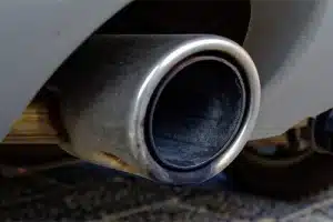 Common Problems Of Cummins Diesel Engines | Mevert Automotive & Tire Center Inc. in Steeleville, IL. Closeup image of the exhaust of a diesel car. Concept image of emissions problem seen in some vehicle running with Cummins engine.
