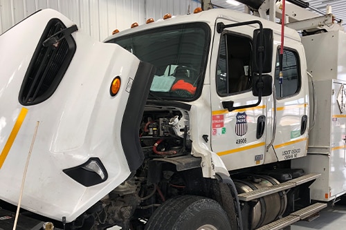 Picture of truck in shop doing preventative maintenance | Mevert Automotive and Tire Center